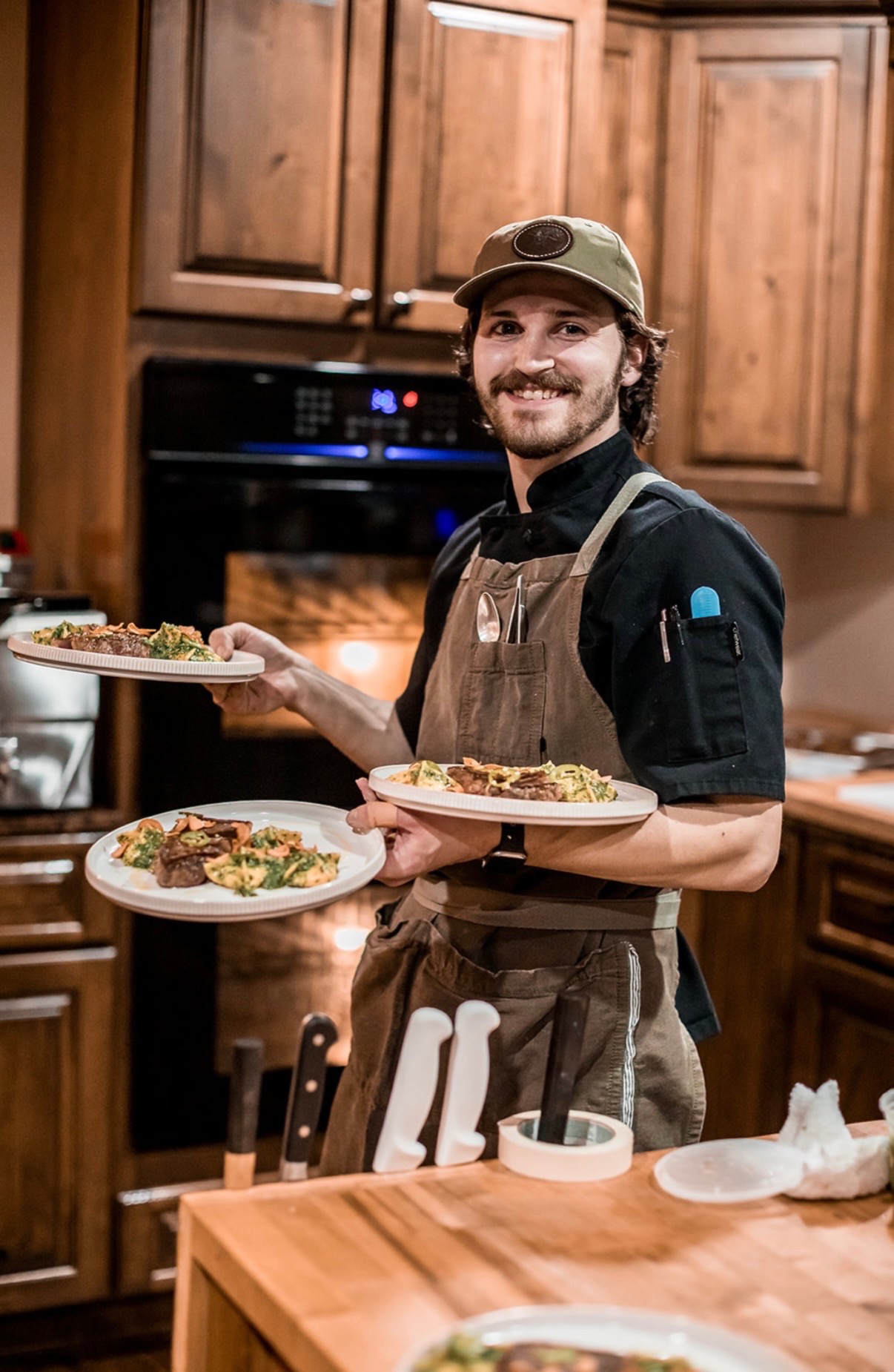 Chef serving plated dishes