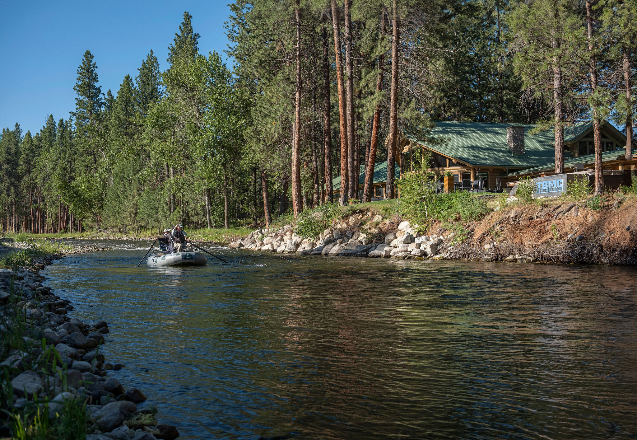 Drift boat on the Bitterroot River approaching the lodge