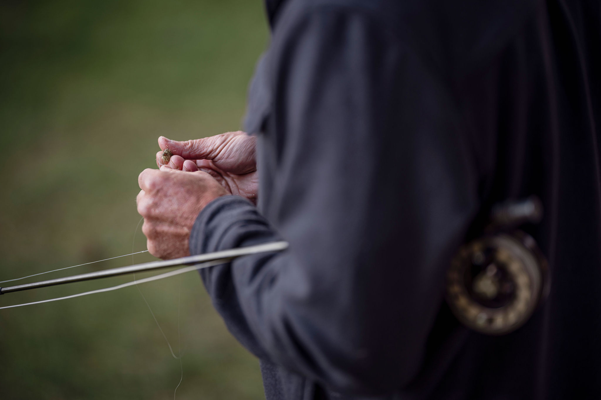 Fly rod and reel detail on the river